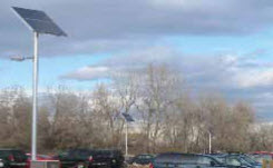 denver-water-board-case-study Daytime view of pole-mounted solar panels in a Denver parking lot