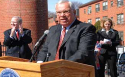 boston-housing-authority-case-study Boston Mayor Thomas M. Menino speaks at a podium outside a housing development owned by the Boston Housing Authority