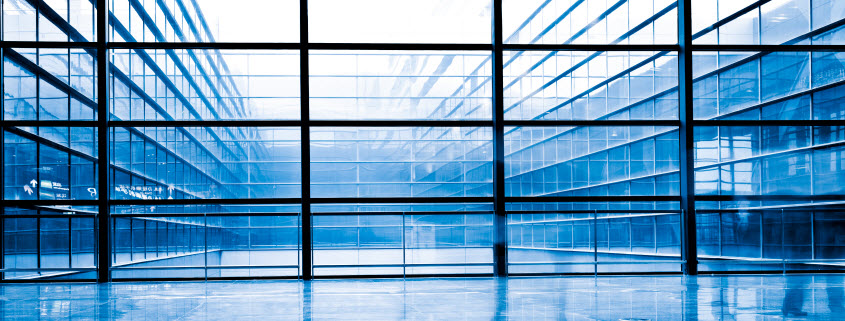 energy-storage Daytime interior view looking out the windwos of an office building, which form a grid with windows across an air shaft