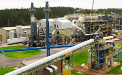 Daytime view of the Savannah River Site Biomass Cogeneration Facility with the biomass intake in the foreground