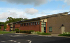 Daytime exterior of the Orenco school