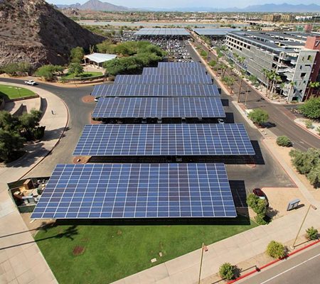 Panoramic aerial view of Arizona State University showing solar canopies over parking lots and on the roof of a parking garage