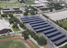 Daytime aerial view of Parris Island Marine Corps base showing solar car port canopies.