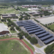 Daytime aerial view of Parris Island Marine Corps base showing solar car port canopies.