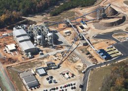 Daytime aerial view of the Department of Energy Savannah River Site Biomass Cogeneration Facility and its surrounding buildings and storage areas