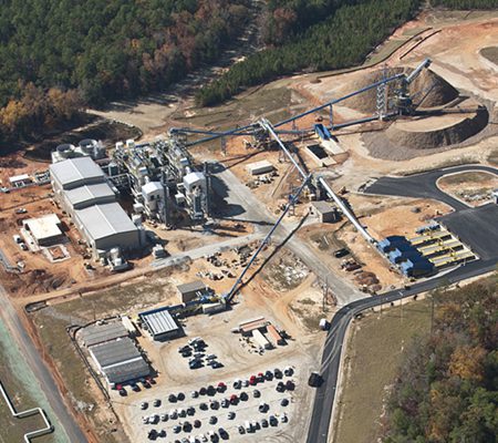 Daytime aerial view of the Department of Energy Savannah River Site Biomass Cogeneration Facility and its surrounding buildings and storage areas