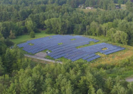 Daytime aerial view of a brownfield solar farm in Stockbridge, Massachusetts.