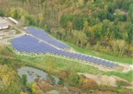 Daytime aerial view of a landfill solar farm in Bethel, Connecticut.