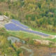 Daytime aerial view of a landfill solar farm in Bethel, Connecticut.