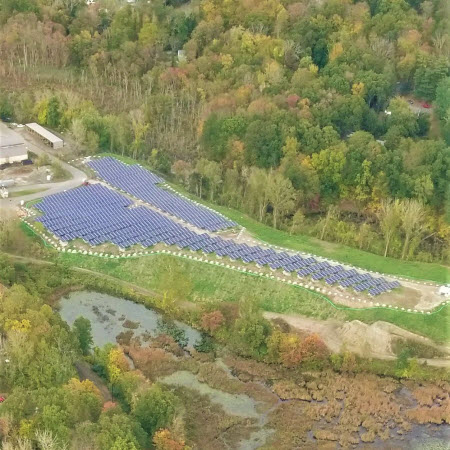bethel-solar-farm-featured-image Daytime aerial view of the Sympaug landfill solar project in Bethel