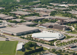 Daytime aerial view of Minnesota State University Mankato showing the football field and Bresnan Arena.