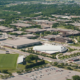Daytime aerial view of Minnesota State University Mankato showing the football field and Bresnan Arena.
