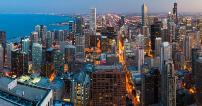 Daytime aerial view of the Chicago skyline alongside Lake Michigan