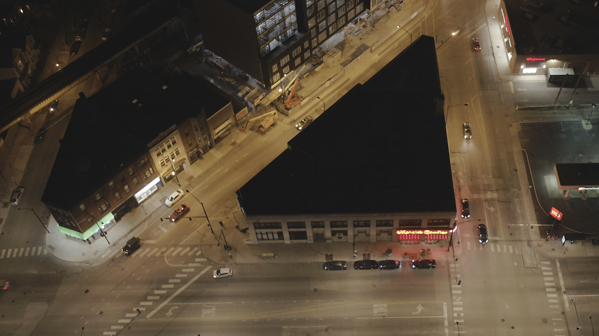 Aerial view of a Chicago city block at night showing improved LED street lighting.