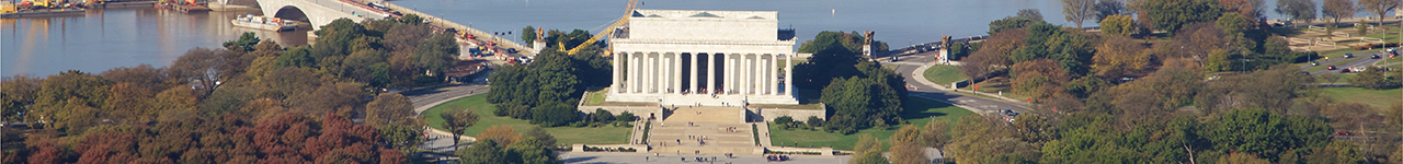 Daytime aerial panoramic view of the Lincoln Memorial on the banks of the Potomac River.