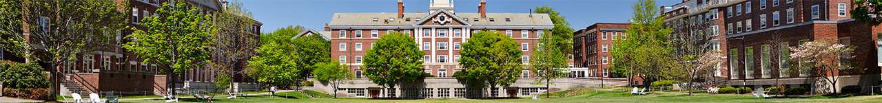 Daytime view of a university quadrangle surrounded by brick buildings.