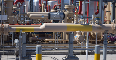 Daytime view of piping and valves in a renewable natural gas plant.