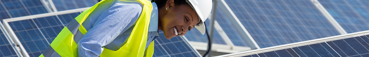 Daytime view of a worker on a solar farm