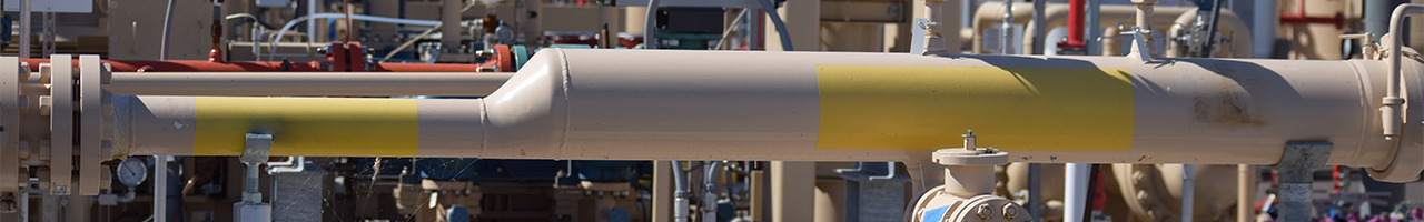 Daytime close up view of piping at a renewable natural gas plant