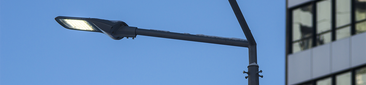 Evening close up view of an LED streetlight outside of a building