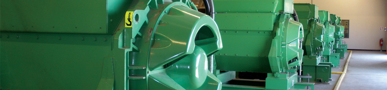 Interior close up view of cogeneration generators in a central plant