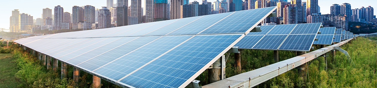 Daytime close-up view of solar panels in an array on a solar farm