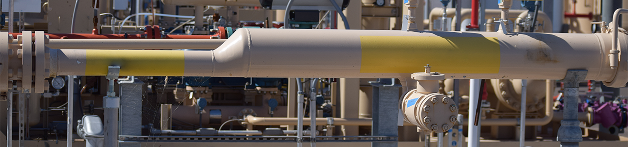 Daytime close up view of piping in a renewable natural gas plant