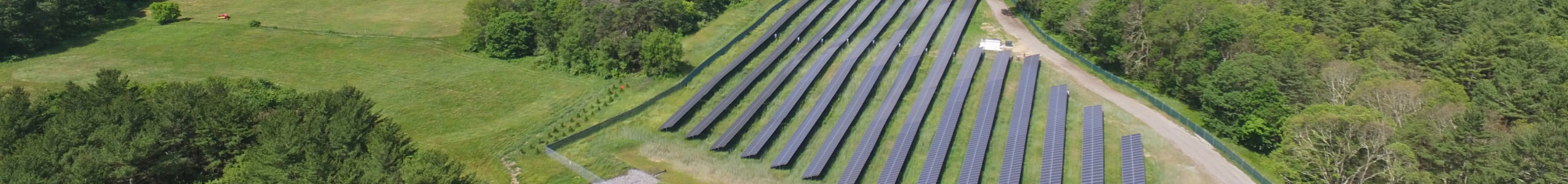 view of green landscape with solar farm