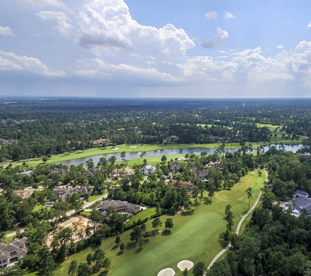 Daytime aerial view of Woodlands Water, Texas golf course.