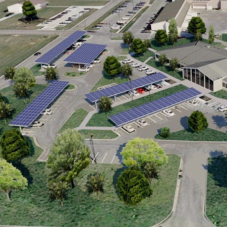 joint-base-san-antonio-case-study-featured-image Daytime aerial view of a main building at Joint Base San Antonio showing renderings of rooftop and carport solar panels