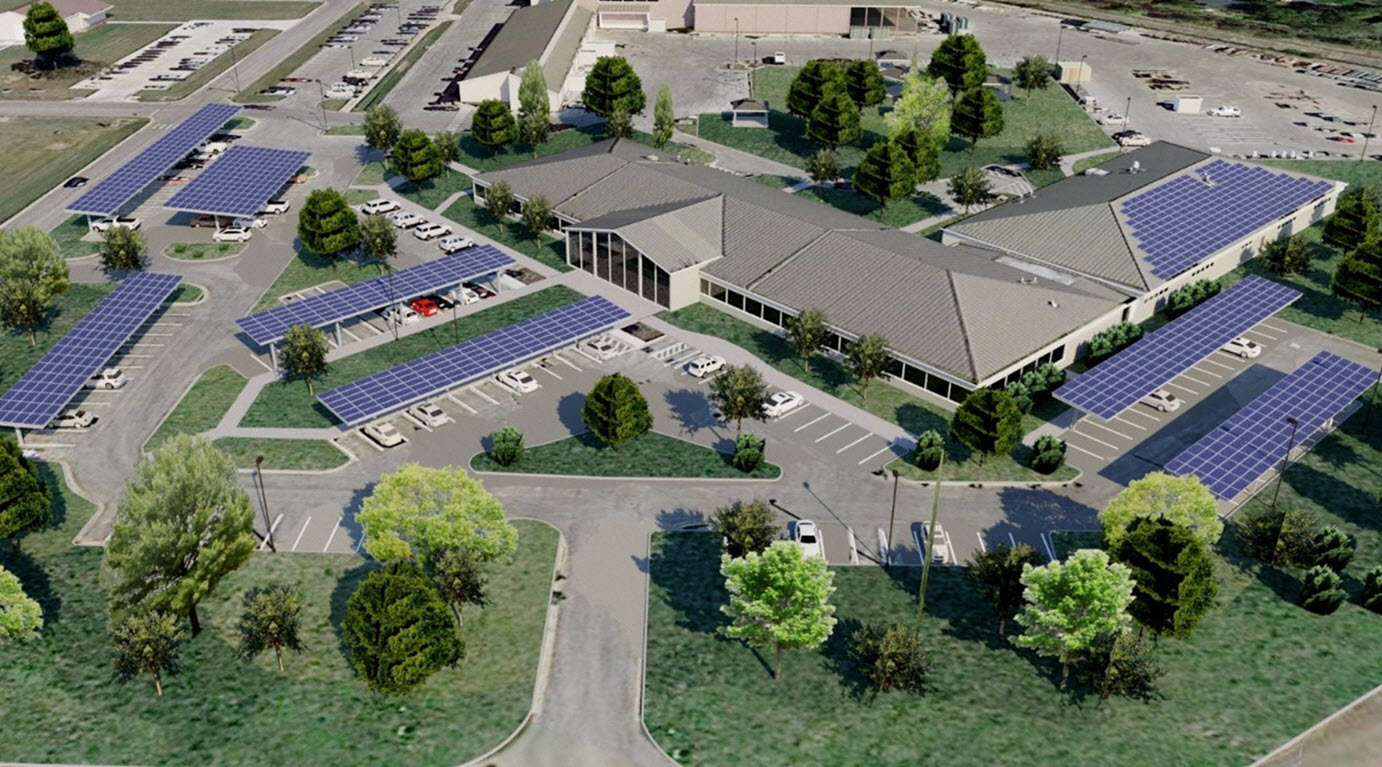 Daytime aerial view of Joint Base San Antonio showing rooftop and carport solar installations