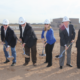 Daytime view of City of Phoenix officials participating in a wastewater treatment plant groundbreaking