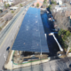Daytime aerial view of a solar car port at Roxbury Community College