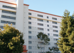 Daytime view of a residential building owned by the San Francisco Housing Authority