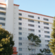 Daytime view of a residential building owned by the San Francisco Housing Authority