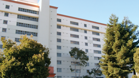 Daytime view of a residential building owned by the San Francisco Housing Authority