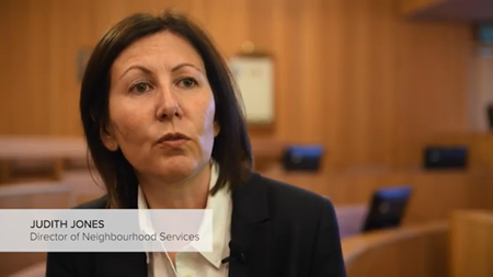 Screen capture from Ameresco video showing Judith Jones Director of Neighbourhood Services for Merthyr Tdyfil Council in her office