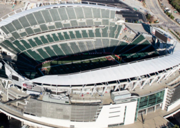 Daytime aerial view of Paul Brown Stadium between Interstate 71 and the Ohio River