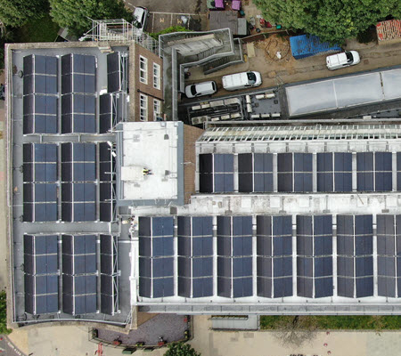 Overhead aerial view of solar panels on the roof of University of West London