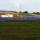 Panoramic daytime view of a hillside solar farm at US Army Fort Detrick