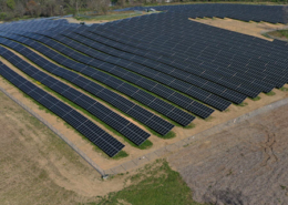 Daytime aerial view of a solar farm at GSK Consumer Healthcare in Oak Hill, New York