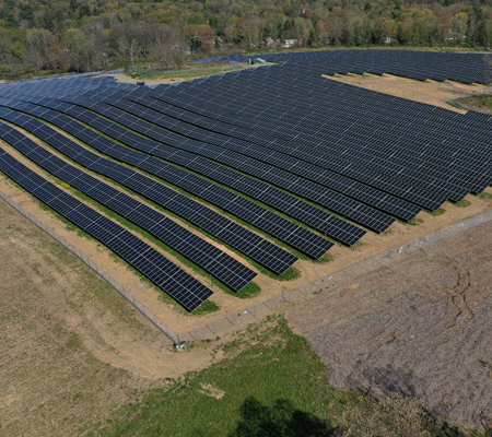 Daytime aerial view of a solar farm at GSK Consumer Healthcare in Oak Hill, New York