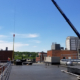Daytime view of construction work on the roof of Massachusetts College of Art and Design