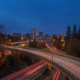 Evening view of the Portland, Oregon skyline with highways in the foreground