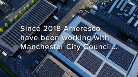 Aerial view of a rooftop solar installation in Manchester UK overlaid with the words Since 2018 Ameresco have been working with Manchester City Council...