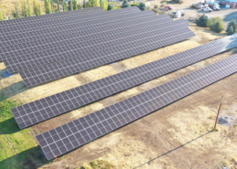 Daytime aerial view of a solar array at the City of Missoula wastewater treatment plant