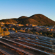 Daytime view of solar car ports at St. John's College with mountains in the background