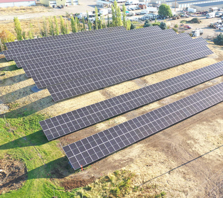 Daytime aerial view of a solar farm in Missoula