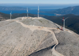 Daytime aerial view of wind turbines on a mountaintop in Kefalonia Greece