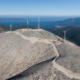 Daytime aerial view of wind turbines on a mountaintop in Kefalonia Greece